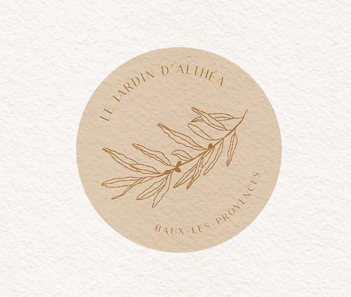 Logo avec une illustration de branche d'olivier